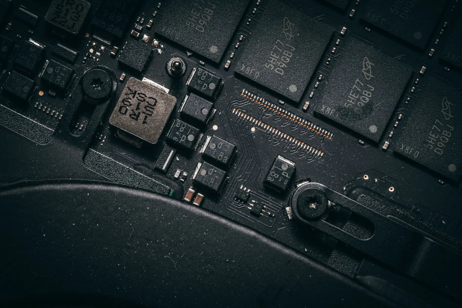 Detailed macro shot of electronic circuit board showing microchips and components, illustrating Oracle releases Java 27 with hybrid post-quantum key exchange for TLS 1.3 on by default
